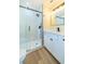 Bathroom with a glass shower, dark fixtures, and white vanity at 2931 Chilton St, Deltona, FL 32738