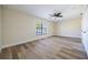 Neutral bedroom features hard surface flooring, large windows, and a ceiling fan at 2931 Chilton St, Deltona, FL 32738