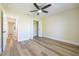 Bedroom features neutral walls, hard surface flooring, and a ceiling fan at 2931 Chilton St, Deltona, FL 32738