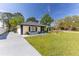 Charming single-story home features neutral paint, black accents, and a well-maintained lawn and inviting curb appeal at 2931 Chilton St, Deltona, FL 32738
