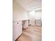 Laundry room featuring white cabinets, marble countertops, and a white washer and dryer at 2931 Chilton St, Deltona, FL 32738