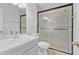 Modern bathroom featuring a glass-enclosed shower, sleek vanity, and updated fixtures at 30 Las Palmas Way, Kissimmee, FL 34743
