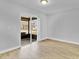 Cozy bedroom with sliding glass doors offering a view of the backyard at 30 Las Palmas Way, Kissimmee, FL 34743