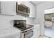 Bright kitchen with sleek, stainless steel appliances and ample counter space at 30 Las Palmas Way, Kissimmee, FL 34743