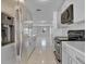 Well-equipped kitchen features stainless steel appliances and stone countertops at 30 Las Palmas Way, Kissimmee, FL 34743