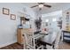 Cozy dining area with a table, chairs, and views of the kitchen, living room, and decor at 3304 Cat Brier Trl, Harmony, FL 34773