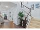Spacious foyer with hardwood floors and a staircase leading to the upper level of the home at 3304 Cat Brier Trl, Harmony, FL 34773