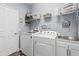 Well-organized laundry room with modern washer and dryer at 3304 Cat Brier Trl, Harmony, FL 34773
