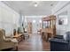 Bright and open living room with a bar, comfortable seating, and ample natural light at 3304 Cat Brier Trl, Harmony, FL 34773
