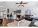 Open concept living room with a partial view into the kitchen and breakfast bar at 3304 Cat Brier Trl, Harmony, FL 34773