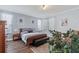 Cozy main bedroom featuring a bed, bench, and ambient lighting at 3304 Cat Brier Trl, Harmony, FL 34773