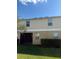 A view of the backyard showing the patio area with lawn at 3555 Rodrick Cir, Orlando, FL 32824