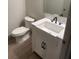Charming half bathroom featuring a pedestal sink with black fixtures and neutral wall paint at 3555 Rodrick Cir, Orlando, FL 32824