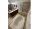 This bathroom features double sinks, a soaking tub, and glass enclosed shower at 3555 Rodrick Cir, Orlando, FL 32824