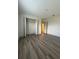 This bedroom has a closet with double doors and hardwood floors at 3555 Rodrick Cir, Orlando, FL 32824