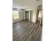 This bedroom features a closet with double doors and hardwood floors at 3555 Rodrick Cir, Orlando, FL 32824