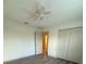 This bedroom features a closet with double doors and hardwood floors at 3555 Rodrick Cir, Orlando, FL 32824