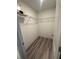 Walk-in closet featuring built-in wire shelving provides ample storage solutions for your wardrobe at 3555 Rodrick Cir, Orlando, FL 32824