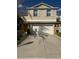 Two story home with two-car garage and neutral toned exterior, perfect for any buyer at 3555 Rodrick Cir, Orlando, FL 32824