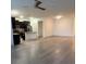 Open kitchen with dark cabinets, granite countertops, island and stainless steel appliances at 3555 Rodrick Cir, Orlando, FL 32824