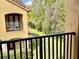 Private balcony overlooking a lush green lawn and mature trees, perfect for relaxation at 3655 Zuma Way, Orlando, FL 32839