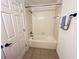 Standard bathroom with a clean bathtub, shower, towel rack, and basic fixtures at 3655 Zuma Way, Orlando, FL 32839