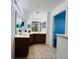 Bathroom featuring double sinks, ample counter space, and a well-lit mirror, offering functionality at 3655 Zuma Way, Orlando, FL 32839