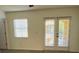 Bright bedroom with large windows, stylish flooring, and access to a private balcony at 3655 Zuma Way, Orlando, FL 32839