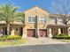 Charming two-story townhome with attached garage and a well-maintained front yard at 3655 Zuma Way, Orlando, FL 32839
