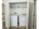Laundry closet featuring side-by-side washer and dryer units, maximizing space and convenience at 3655 Zuma Way, Orlando, FL 32839