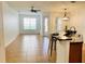 Bright living room featuring neutral paint, tile floors, and ceiling fan at 3655 Zuma Way, Orlando, FL 32839