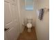 Small, functional toilet room with a standard toilet, minimal décor, and basic fixtures at 3655 Zuma Way, Orlando, FL 32839