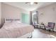 Cozy bedroom features colorful furniture, hardwood floors, and natural light at 3705 Apopka Ridge Cir, Apopka, FL 32703