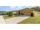 A single Gathering home with a two car garage and a landscaped lawn at 3705 Apopka Ridge Cir, Apopka, FL 32703