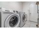 A laundry room featuring a white Samsung washing machine and LG dryer at 3705 Apopka Ridge Cir, Apopka, FL 32703