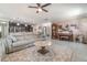 Open-concept living room featuring tile floors, modern furnishings and an upright piano at 3705 Apopka Ridge Cir, Apopka, FL 32703