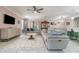 Open-concept living room featuring tile floors, modern furnishings and a ceiling fan at 3705 Apopka Ridge Cir, Apopka, FL 32703