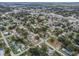 Expansive aerial of homes nestled amongst green trees in a charming residential community at 406 10Th St, St Cloud, FL 34769
