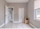 Neutral bedroom with a closet and light wood floors at 406 10Th St, St Cloud, FL 34769