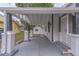 Long view under carport with columns featuring secure front door at 406 10Th St, St Cloud, FL 34769