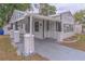 Street view of home featuring a covered carport, secure front door, and classic siding at 406 10Th St, St Cloud, FL 34769