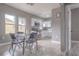 View of the kitchen and eat-in area with stainless steel appliances and modern finishes at 406 10Th St, St Cloud, FL 34769