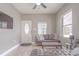 Cozy living room with modern furnishings, natural light, and front door entrance at 406 10Th St, St Cloud, FL 34769