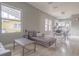 Open-concept living area with hardwood floors, great natural light, and view to the kitchen at 406 10Th St, St Cloud, FL 34769