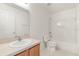 Bathroom featuring shower-tub combo, vanity and medicine cabinet above the toilet at 4061 Flowering Peach Ln, St Cloud, FL 34772