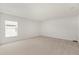 Spacious carpeted bedroom with a large window providing natural light at 4061 Flowering Peach Ln, St Cloud, FL 34772
