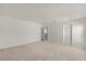 Large carpeted bedroom with a closet and an entry to another room at 4061 Flowering Peach Ln, St Cloud, FL 34772