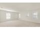 Large bonus room with neutral carpeting and an abundance of natural light at 4061 Flowering Peach Ln, St Cloud, FL 34772