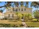Charming two-story home with lush landscaping and a welcoming walkway at 4061 Flowering Peach Ln, St Cloud, FL 34772