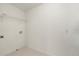 Clean laundry room features a wire shelf and washer hookups at 4061 Flowering Peach Ln, St Cloud, FL 34772